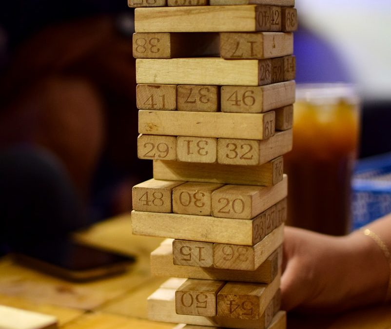 persons playing brown wooden blocks